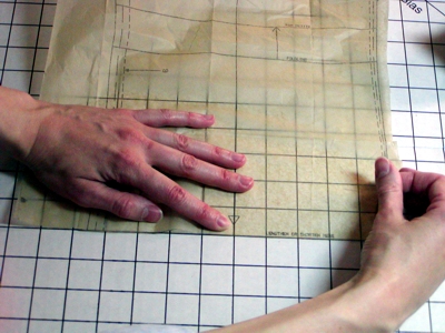 Pin sewing pattern to cutting board image